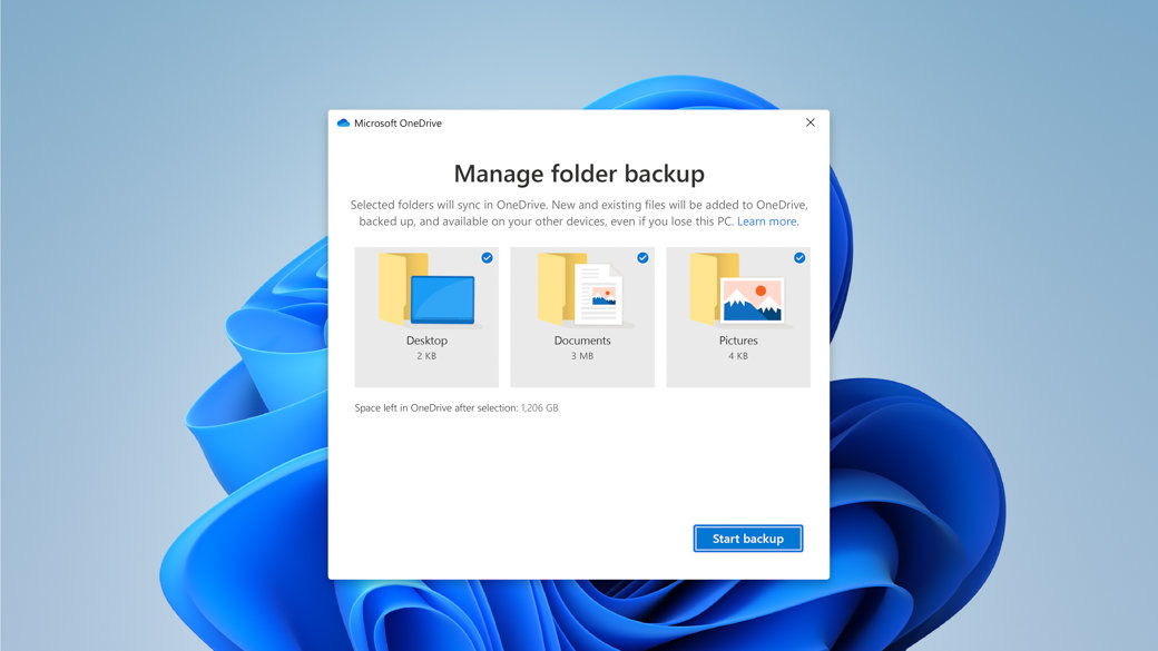 Il fiore di Windows sullo sfondo con una finestra di dialogo di Microsoft OneDrive per gestire il backup delle cartelle